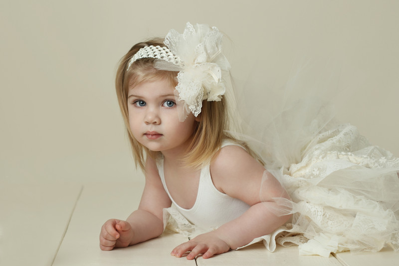 An image of a two year old, I recommended that we try to get her into modeling children's clothing 