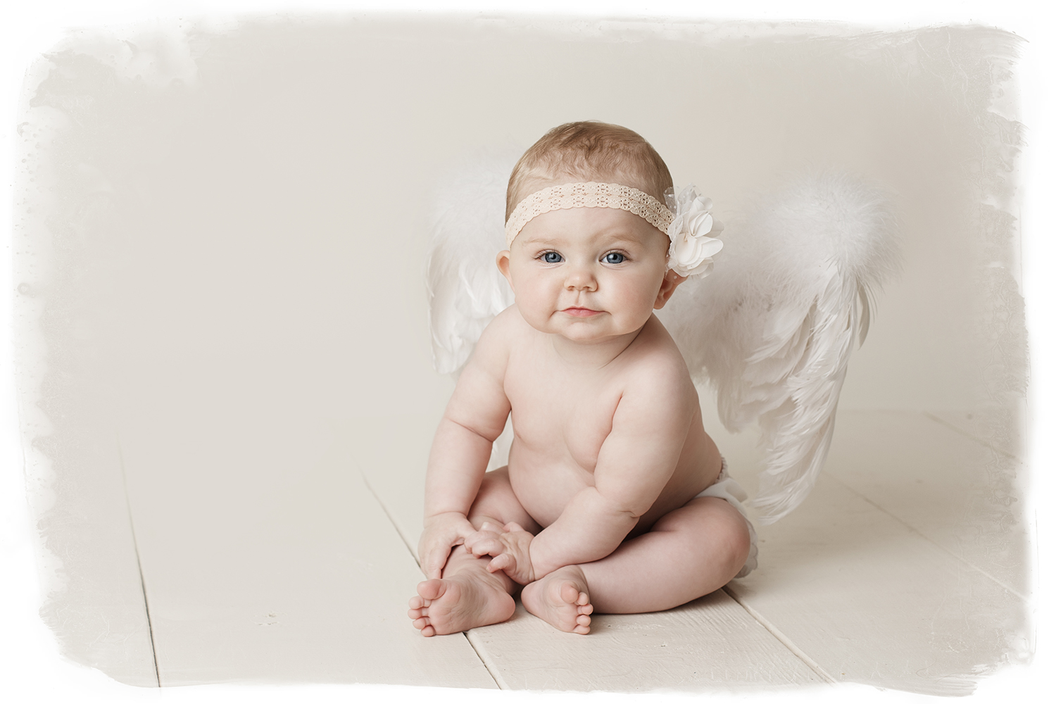 baby in angel wings