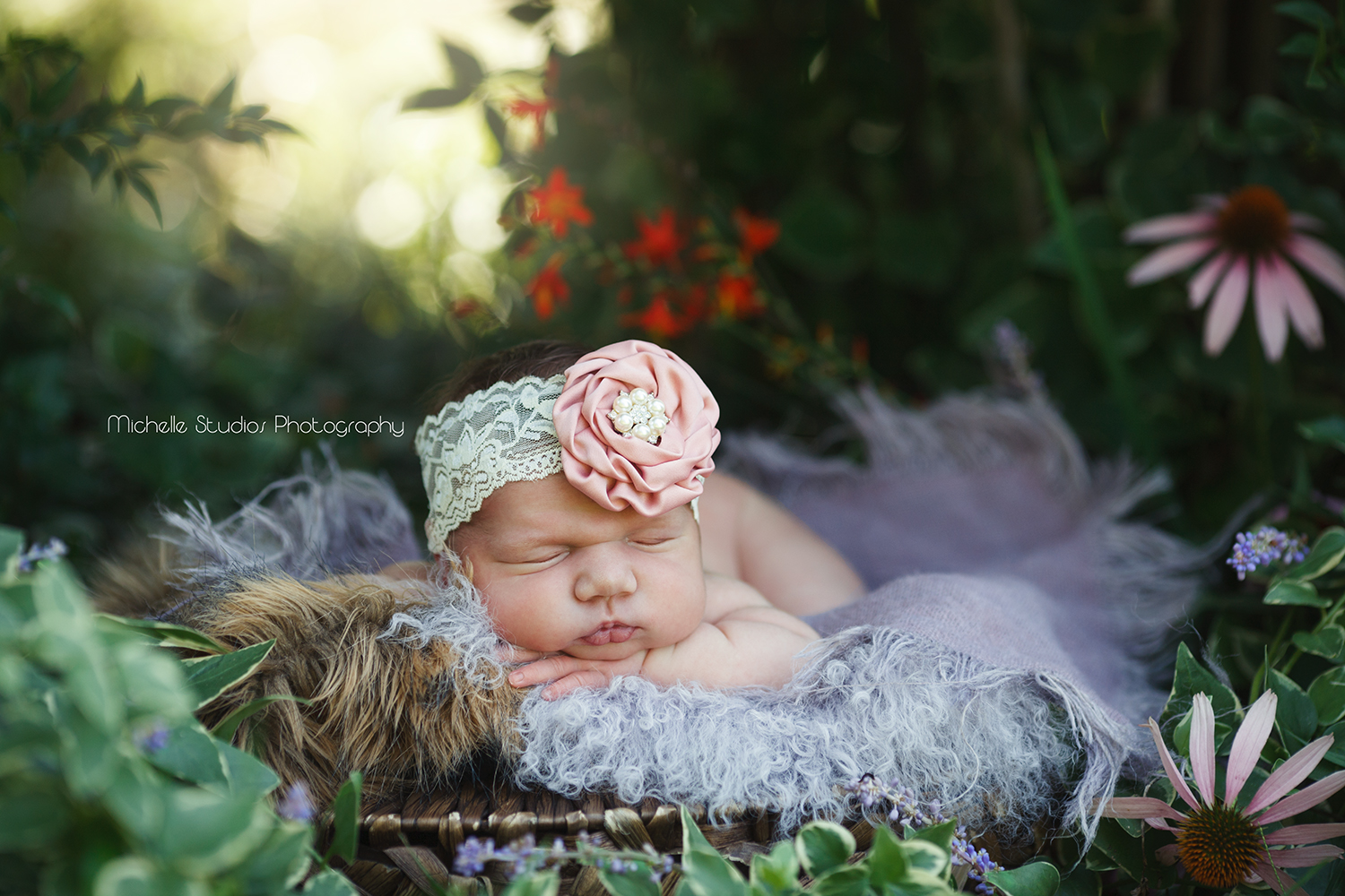 Raleigh newborn in fairy garden with cute cheeks