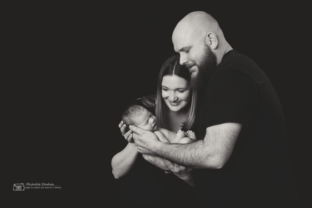 family shot with a newborn in Raleigh portrait studio