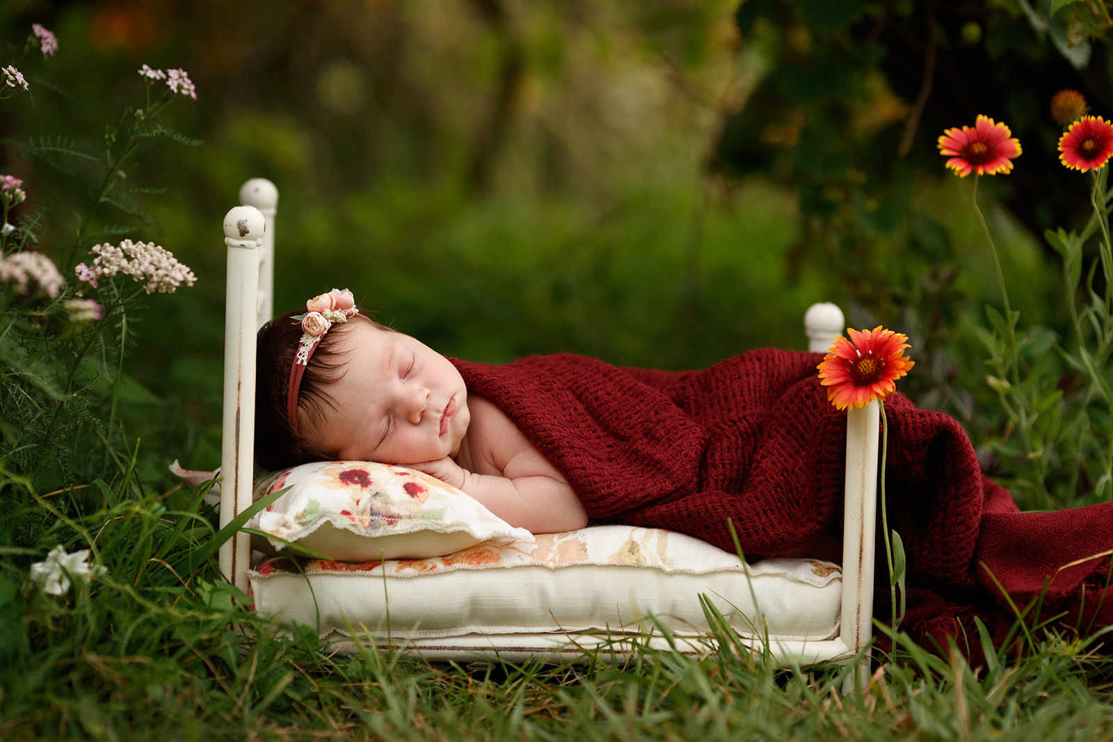 newborn girl on bed by Rozzi Rayne 
